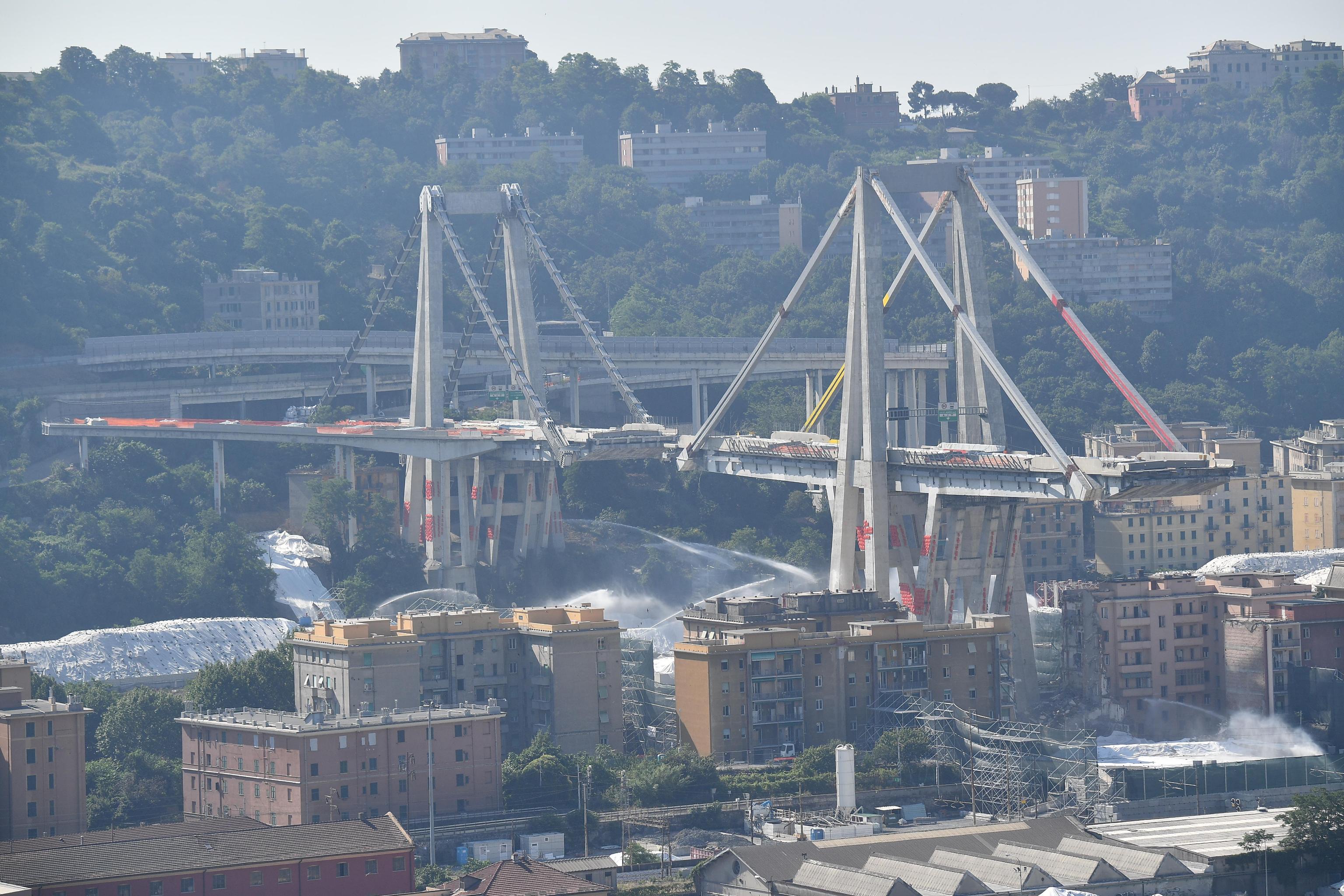 A general view of the demolition "pile" 10 and 11 Morandi bridge with micro-explosive charges, in Genoa, Italy, 28 june 2019. The new viaduct replacing the Morandi bridge is expected to be completed by  2020. The Morandi bridge partially collapsed on 14 august 2018 killing 43 people. ANSA/LUCA ZENNARO