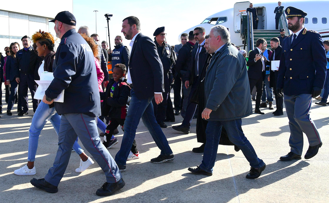 Italian Deputy Prime Minister and Interior Minister, Matteo Salvini (C) is seen upon the arrival of 51 migrants coming from reception centers in Niger and identified by the UNHCR (United Nations High Commissioner for Refugees), at the airport of Pratica di Mare, near Rome, Italy, 14 November 2018. According to reports, the migrants, who were taken away from Libyan prisons by the UNHCR and evacuated to a transit center in Niger, arrived on the day to Italy, which is waiting for other European countries to give the availability to accept a quota. ANSA/ETTORE FERRARI