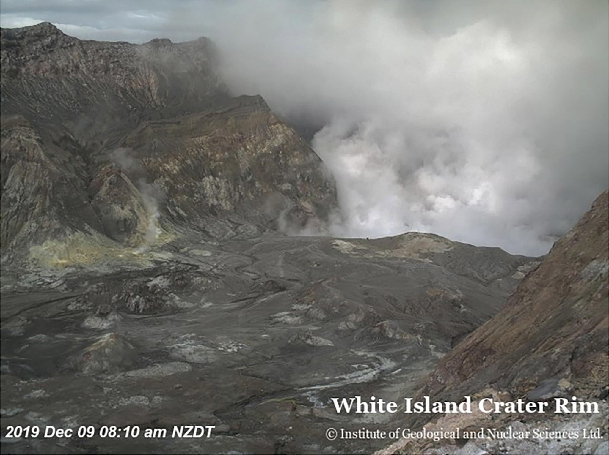 epa08056406 A handout screen grab of a video released by New Zealand's Institute of Geological and Nuclear Sciences (GNS Science) of volcano Whakaari, or White Island, located in the Bay of Plenty, New Zealand, 09 December 2019. The volcano, located around 40km offshore of the Bay of Plenty, has erupted on the day and sent huge amounts of white smoke - most likely steam - into the air in the blast. Authorities are working to coordinate a search and rescue operation following the volcanic eruption.  EPA/NEW ZEALAND INSTITUTE OF GEOLOGICAL AND NUCLEAR SCIENCES HANDOUT -- BEST QUALITY AVAILABLE -- AUSTRALIA AND NEW ZEALAND OUT HANDOUT EDITORIAL USE ONLY/NO SALES