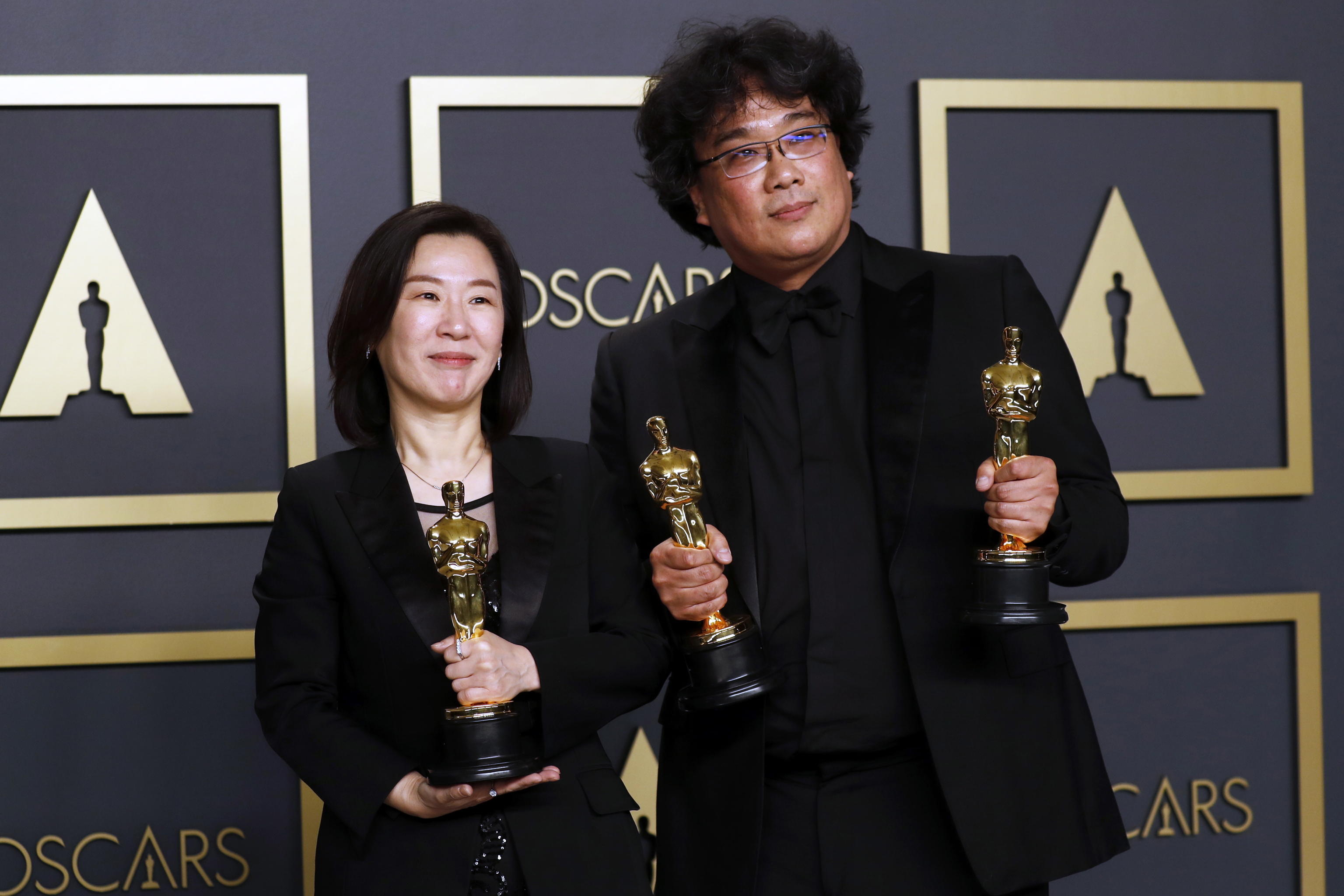 epa08208183 Kwak Sin Ae and Bong Joon Ho pose in the press room with the Oscar for Best Picture, Best Directing and Best International Feature Film for 'Parasite' during the 92nd annual Academy Awards ceremony at the Dolby Theatre in Hollywood, California, USA, 09 February 2020. The Oscars are presented for outstanding individual or collective efforts in filmmaking in 24 categories.  EPA/DAVID SWANSON
