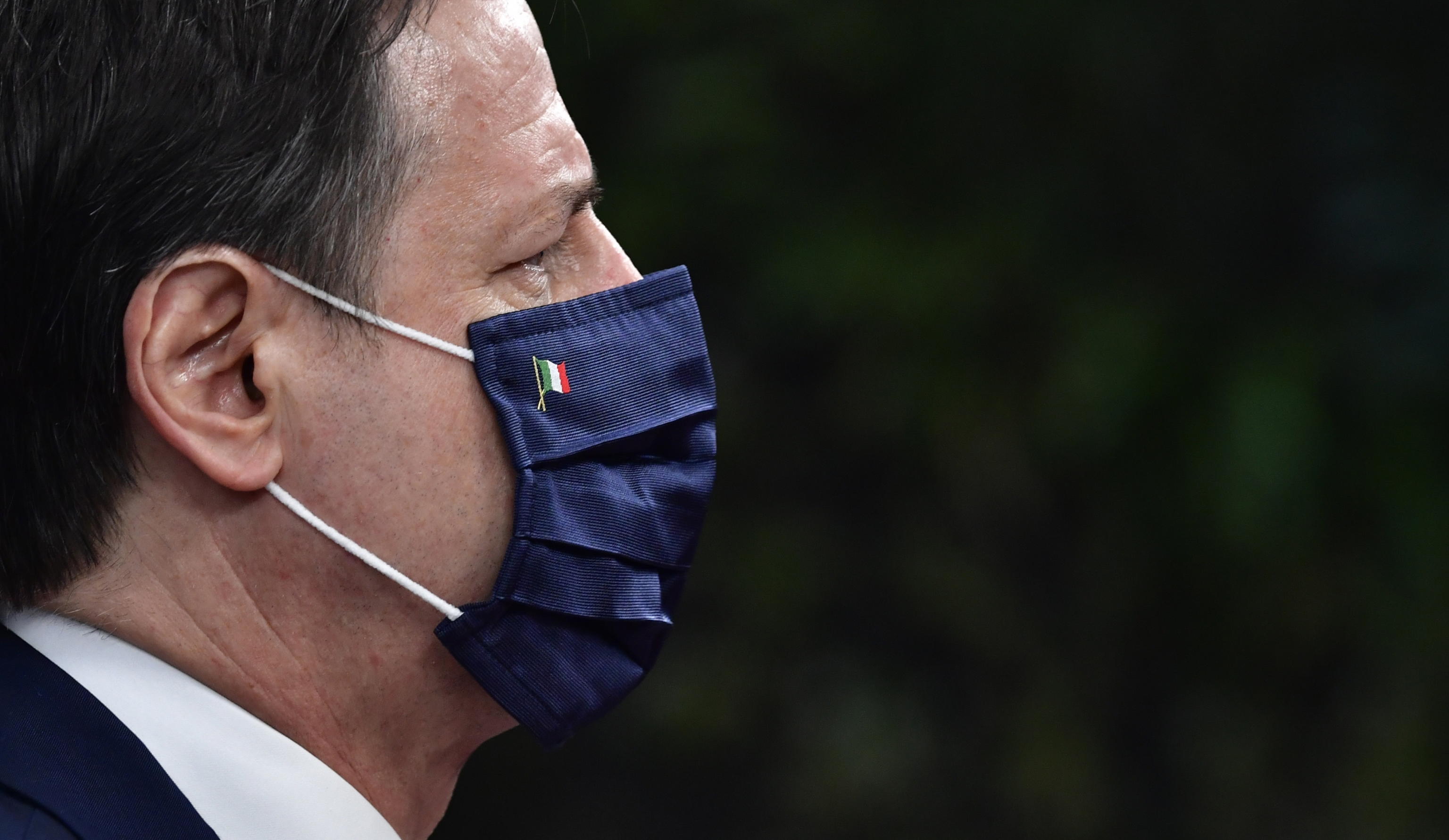 epa08551421 Italy's Prime Minister Giuseppe Conte wearing a face mask arrives for an EU summit at the European Council building in Brussels, Belgium, 17 July 2020. European Union nations leaders meet face-to-face for the first time since February to discuss plans responding to coronavirus crisis and new long-term EU budget at the special European Council on 17 and 18 July.  EPA/JOHN THYS / POOL