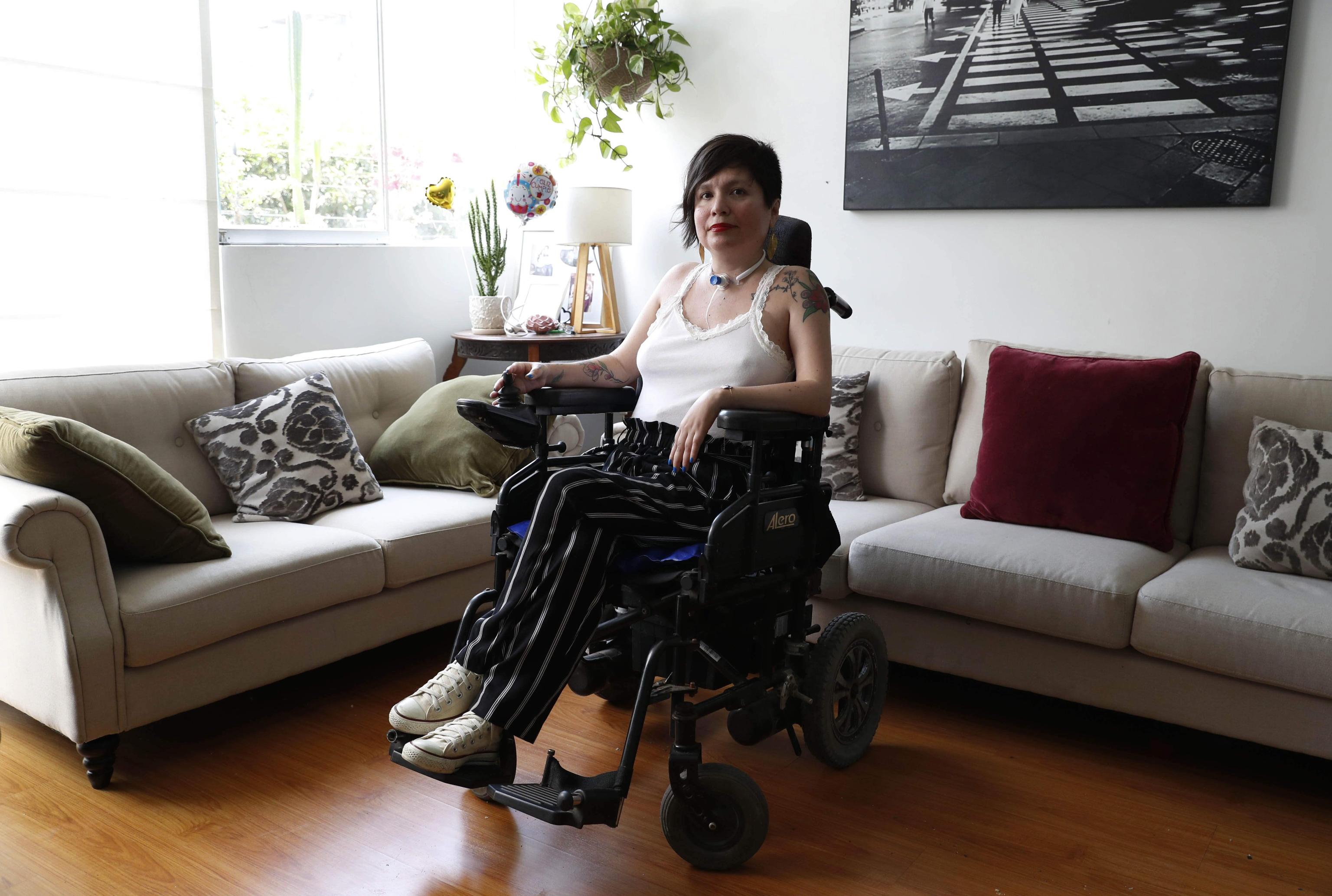 epa08063216 Ana Estrada, a woman suffering from polymyositis, a degenerative muscular disease, poses during an interview at her home in Lima, Peru, 10 December 2019 (issued 11 December 2019). From her humble blog and with almost her entire body paralyzed, Ana Estrada has begun an arduous struggle for Peru to be the second country in Latin America to legalize euthanasia.  EPA/Paolo Aguilar