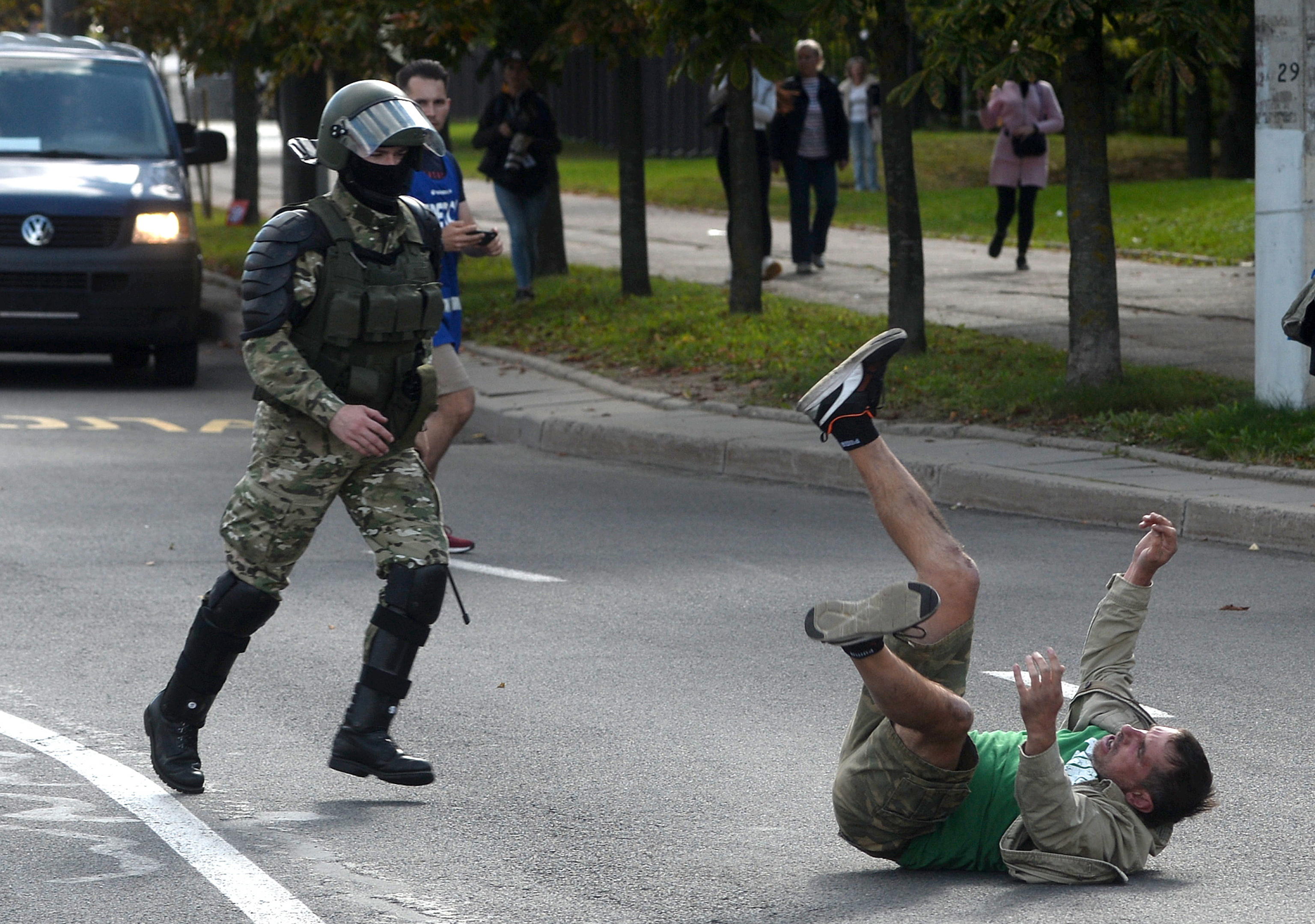 epa08666868 A Belarusian policeman runs to detain a participant during a rally to protest against the presidential election results in Minsk, Belarus, 13 September 2020. Opposition activists continue their every day protest actions, demanding new elections under international observation.  EPA/STRINGER