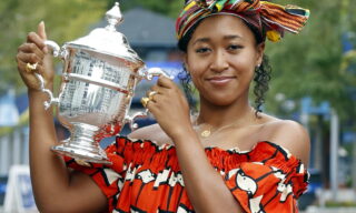 epa08666559 Naomi Osaka of Japan poses with the Championship Trophy on the grounds of the US Open Tennis Championships at the USTA National Tennis Center in Flushing Meadows, New York, USA, 13 September 2020. Due to the coronavirus pandemic, the US Open is being played without fans and runs from 31 August through 13 September.  EPA/JASON SZENES
