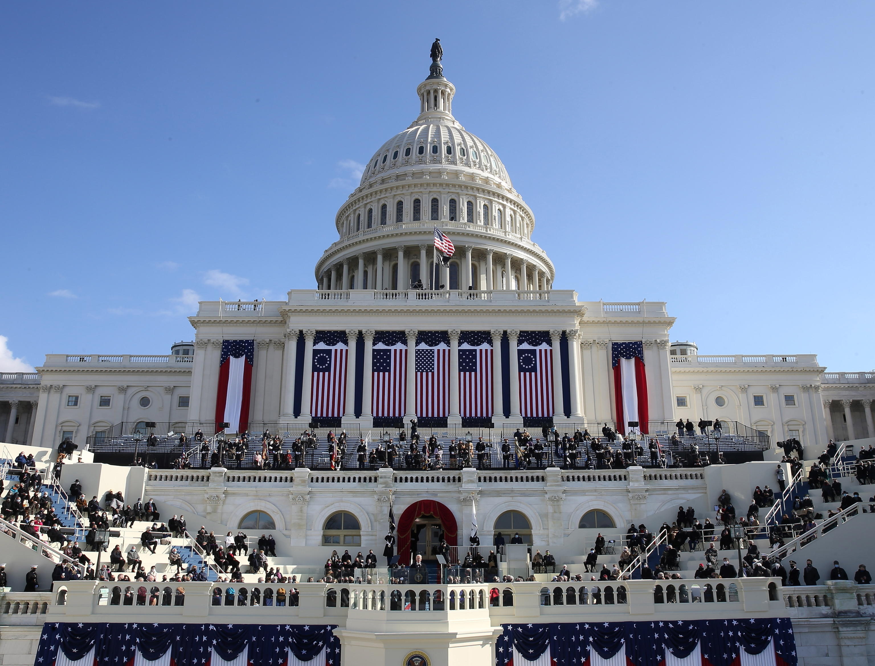 epaselect epa08952678 United States President Joe Biden (C) delivers an address after being sworn in during his inauguration as US President in Washington, DC, USA, 20 January 2021. Biden won the 03 November 2020 election to become the President of the United States of America.  EPA/MICHAEL REYNOLDS