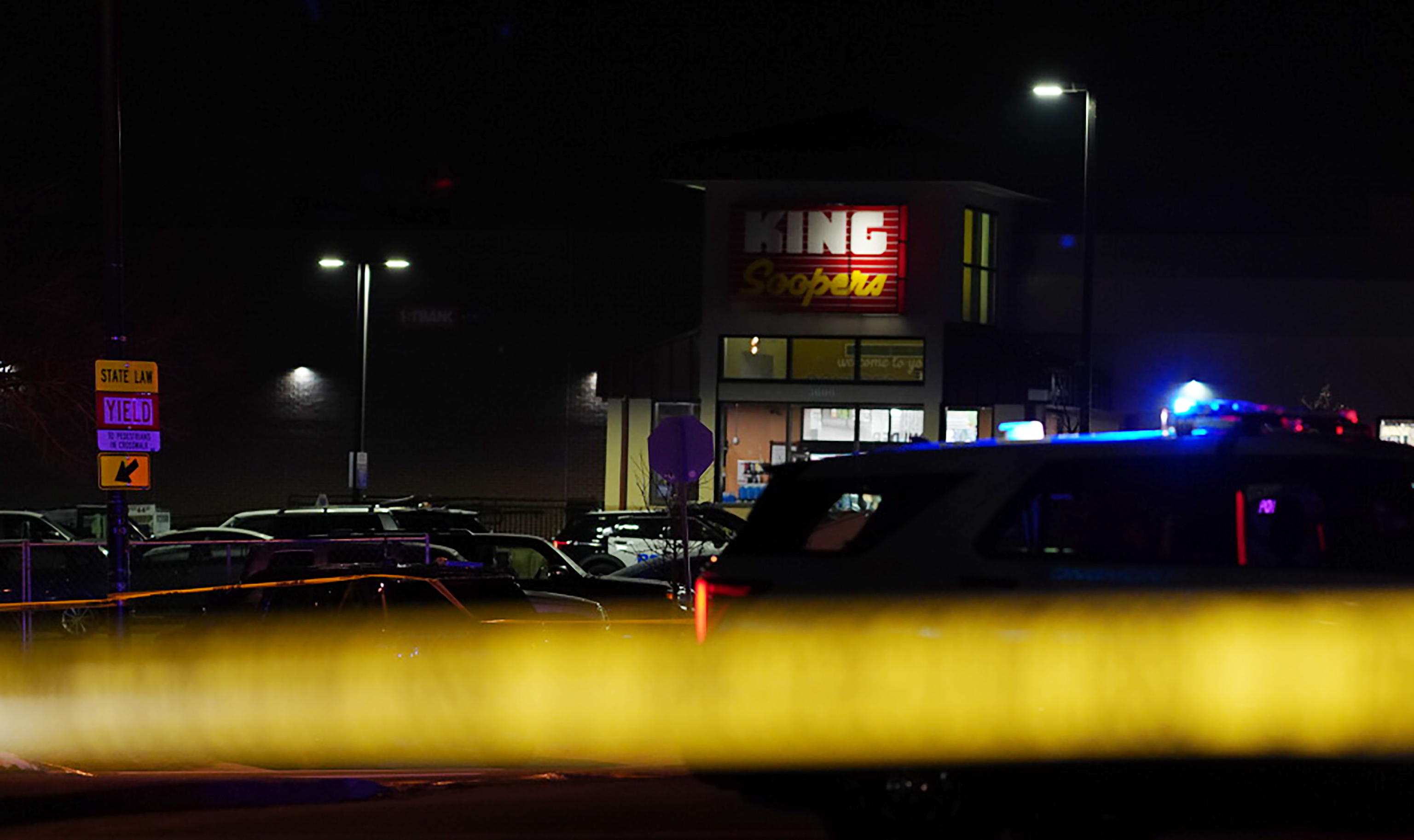 epa09090806 Police and officials investigate the scene of a mass shooting at the King Soopers supermarket in Boulder, Colorado, USA, 22 March 2021. At least ten people, including Boulder Police officer Eric Talley, were killed after a gunman, later taken into custody, started shooting in the parking lot and inside the supermarket.  EPA/BRENDAN DAVIS