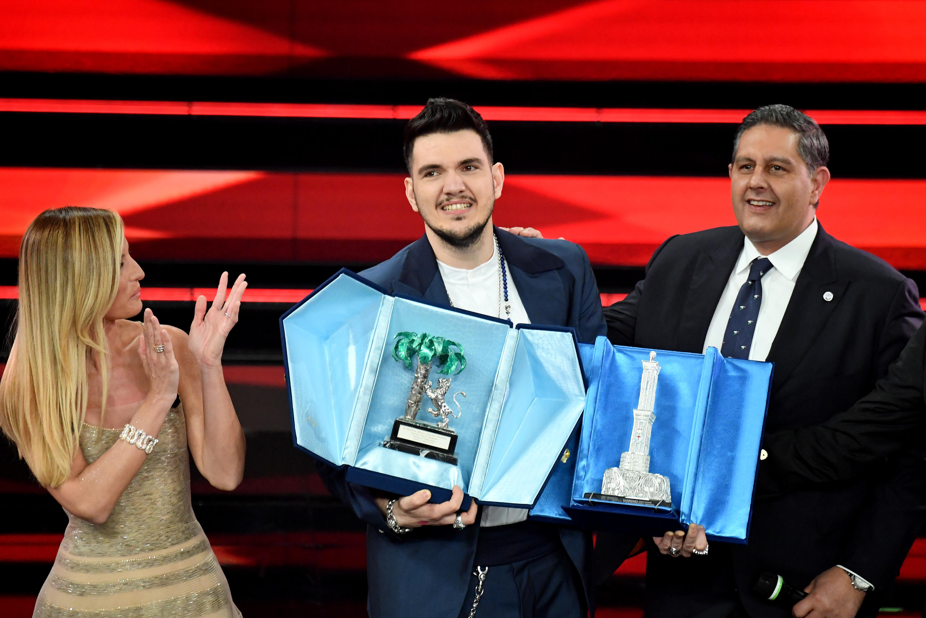 Italian conductor Beatrice Venezi (L) and  the President of Liguria Region Giovanni Toti with Italian singer Gaudiano (C) with the prize after winning in the category 'Nuove Proposte' on stage at the Ariston theatre during  the 71st Sanremo Italian Song Festival, Sanremo, Italy, 05 March 2021. The festival runs from 02 to 06 March.    ANSA/ETTORE FERRARI