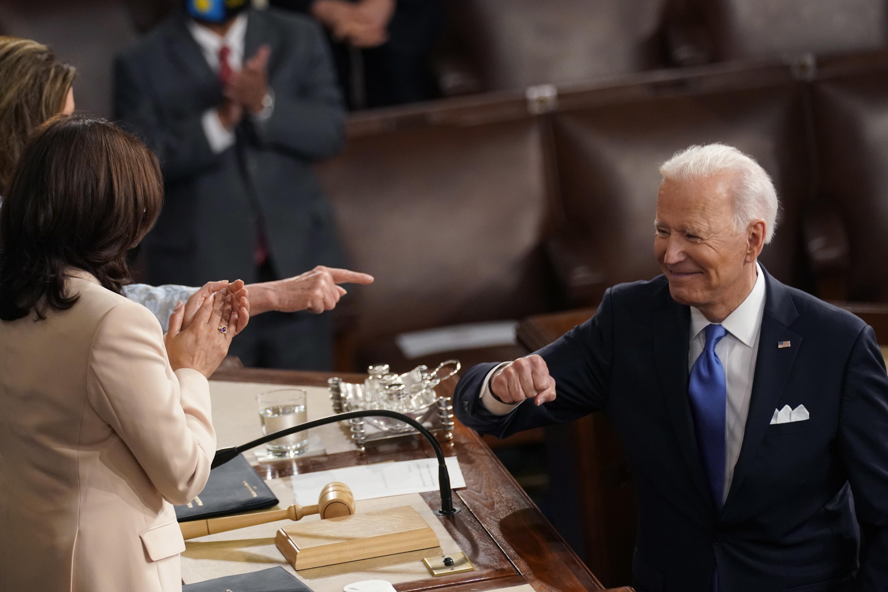 epa09166617 US President Joe Biden turns to Vice President Kamala Harris and House Speaker Nancy Pelosi of Calif., after speaking to a joint session of Congress in the House Chamber at the US Capitol in Washington, DC, USA, 28 April 2021.  EPA/Andrew Harnik / POOL