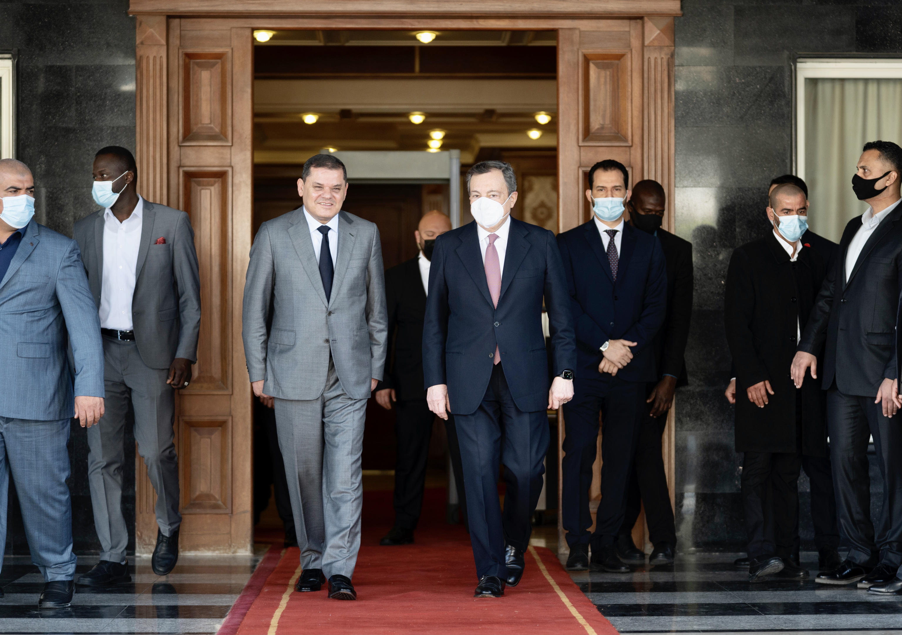 A handout photo made available by Chigi's Palace press office shows Libya's interim Prime Minister Abdul Hamid Dbeibah (L) welcomes with Italian Prime Minister Mario Draghi (R) at the prime minister's office in Tripoli, Libya, 06 April 2021. ANSA/FILIPPO ATTILI / PALAZZO CHIGI PRESS OFFICE HANDOUT HANDOUT EDITORIAL USE ONLY/NO SALES