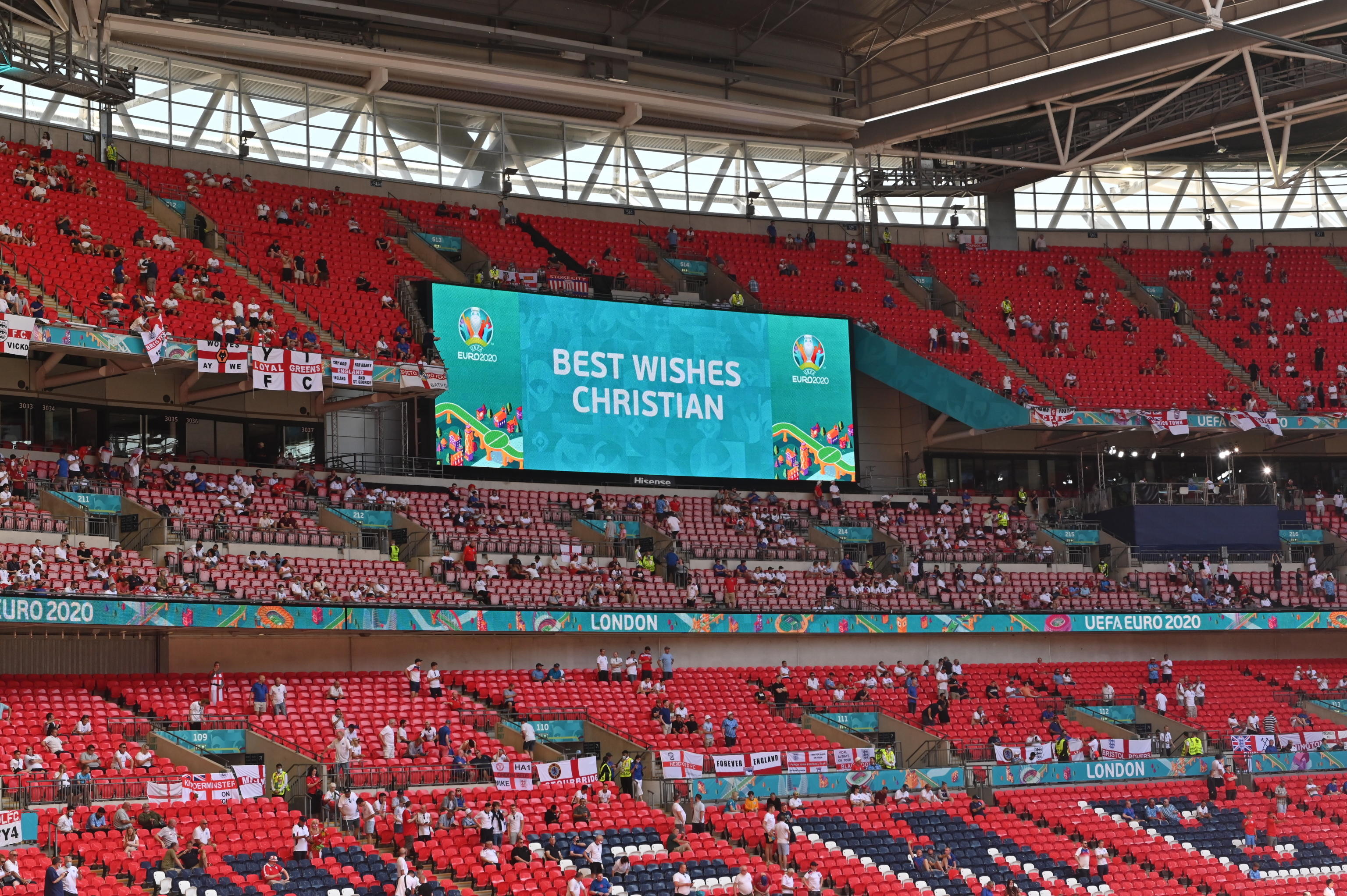 A screen sends Best Wishes to Danish national soccer player Chritian Eriksen before the UEFA EURO 2020 group D preliminary round soccer match between England and Croatia in London, Britain, 13 June 2021. Eriksen collapsed on the pitch during the UEFA EURO 2020 match between Denmark and Finland on 12 June 2021 and received medical treatment  before being stretchered off to a hospital.  ANSA/Justin Tallis / POOL (RESTRICTIONS: For editorial news reporting purposes only. Images must appear as still images and must not emulate match action video footage. Photographs published in online publications shall have an interval of at least 20 seconds between the posting.)