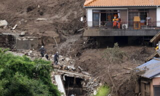 epa09328383 Rescue workers are searching for missing people on the mudslide triggered by torrential rain at hot-spring resort area Izusan in Atami, Shizuoka Prefecture, central Japan, 07 July 2021 while about 1,700 rescuers are deployed. Shizuoka Prefecture announced 7 July 2021 the city has not confirmed about 27 people's safety yet after the mudslide at Izusan area on 03 July 2021. Seven people have been killed by the mudslide.  EPA/JIJI JAPAN OUT EDITORIAL USE ONLY/  NO ARCHIVES