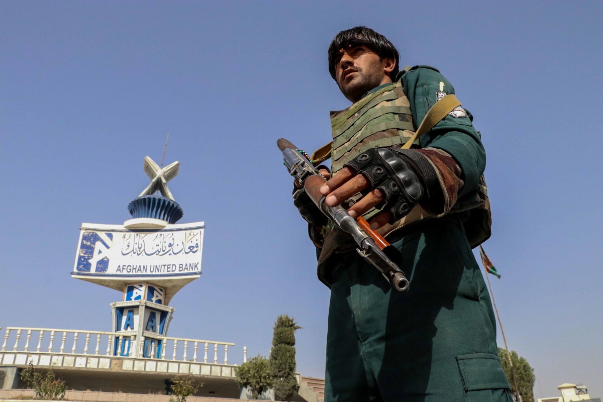 epa09411044 An Afghan security official stands gaurd at a check point in Kandahar, Afghanistan, 12 August 2021. The Afghan government 08 July urged the international community to respond to the needs of 5 million people internally displaced by war and drought in the last two years amid a worsening situation due to a spike in violence. The United States and NATO troops began the final stages of withdrawal more than two months ago, ending a 20-year mission and handing over nearly all military bases to the Afghan army  EPA/M SADIQ