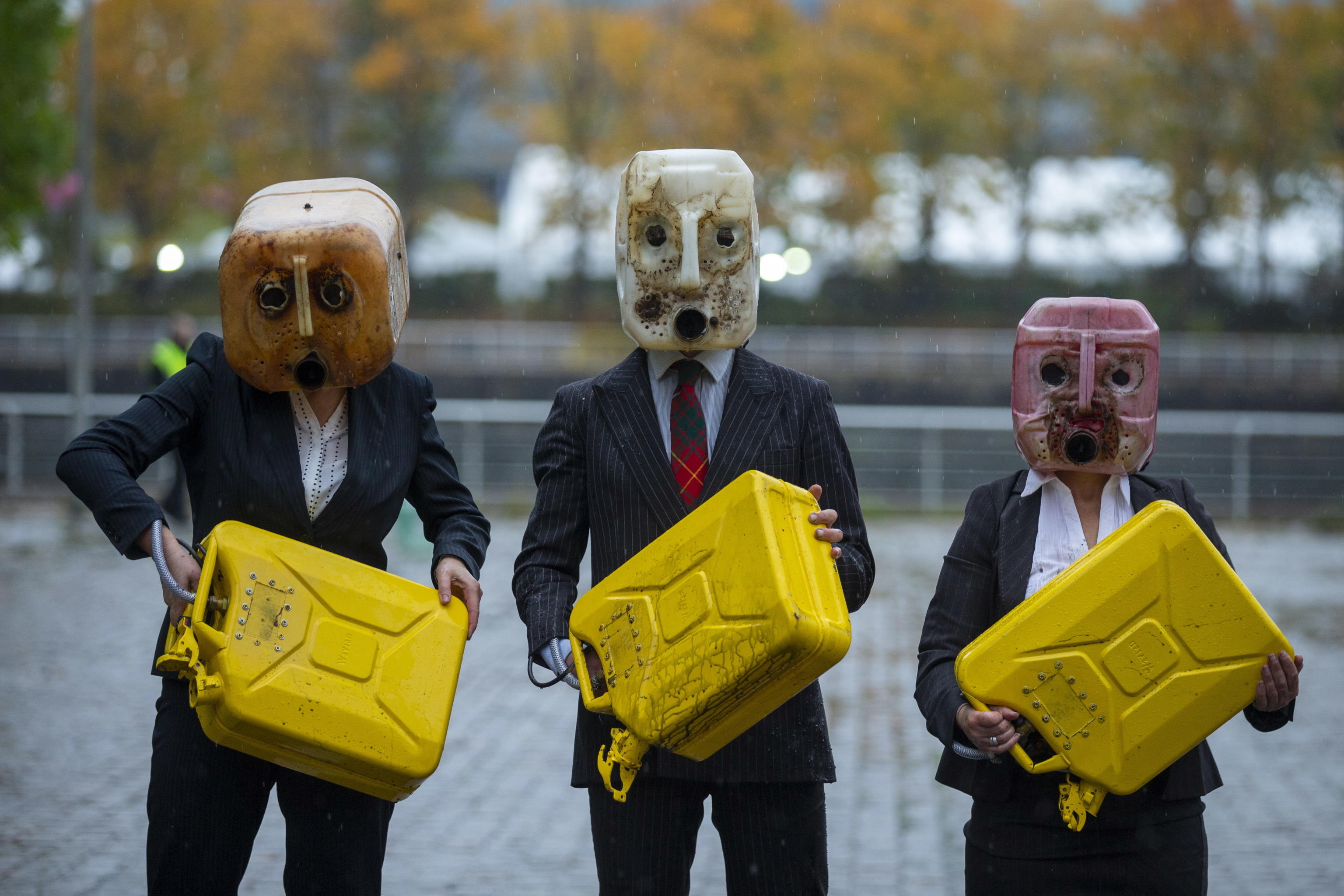 epa09551884 Ocean Rebellion put on a display of puking oil heads ahead of climate change conference COP26 in Glasgow, Britain, 29 October 2021.  EPA/Robert Perry