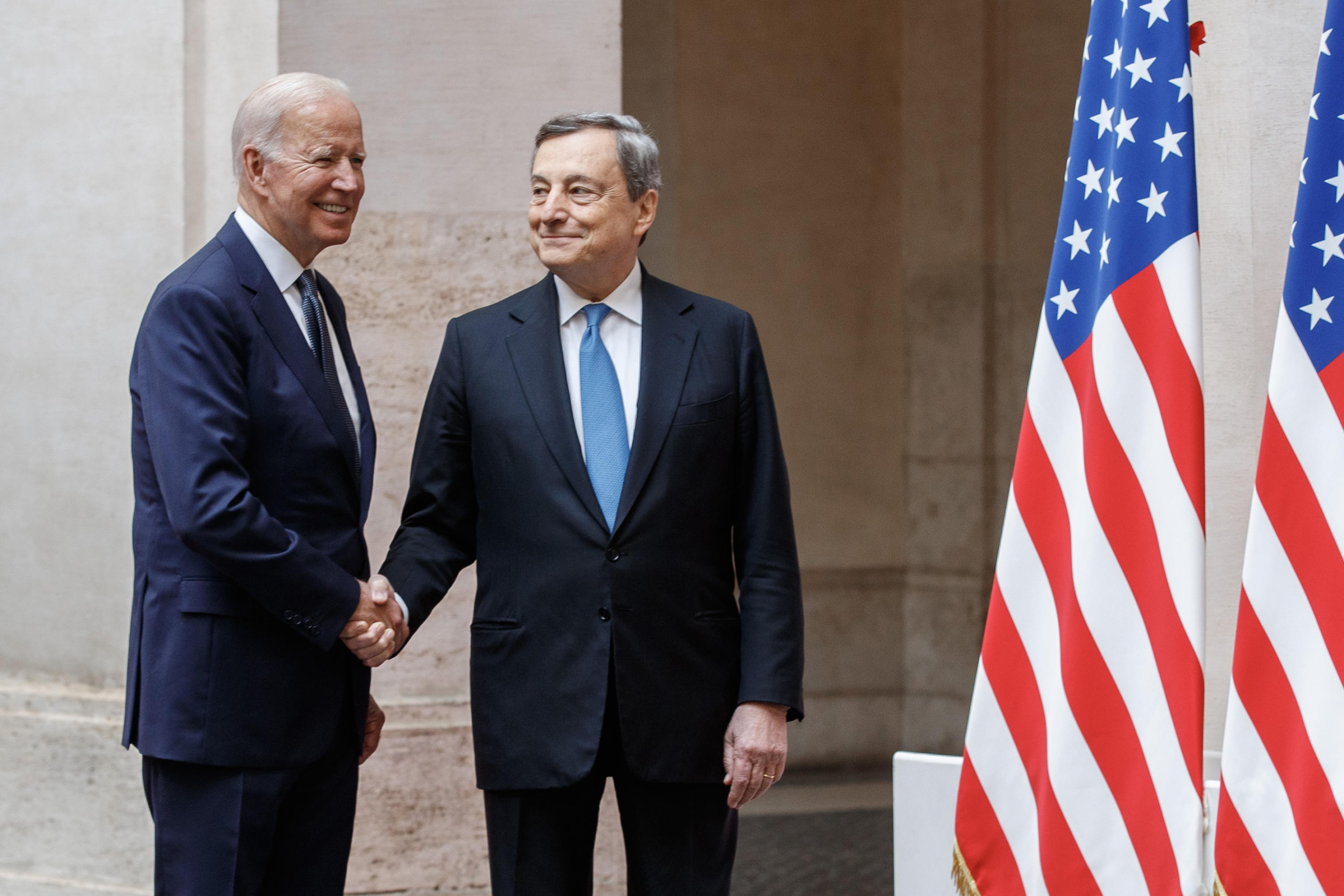 Italy's Prime Minister, Mario Draghi (R) greets US President Joe Biden upon his arrival for their meeting at the Chigi palace in Rome on October 29, 2021, ahead of an upcoming G20 summit of world leaders to discuss climate change, covid-19 and the post-pandemic global recovery. ANSA/ROBERTO MONALDO/POOL/LAPRESSE