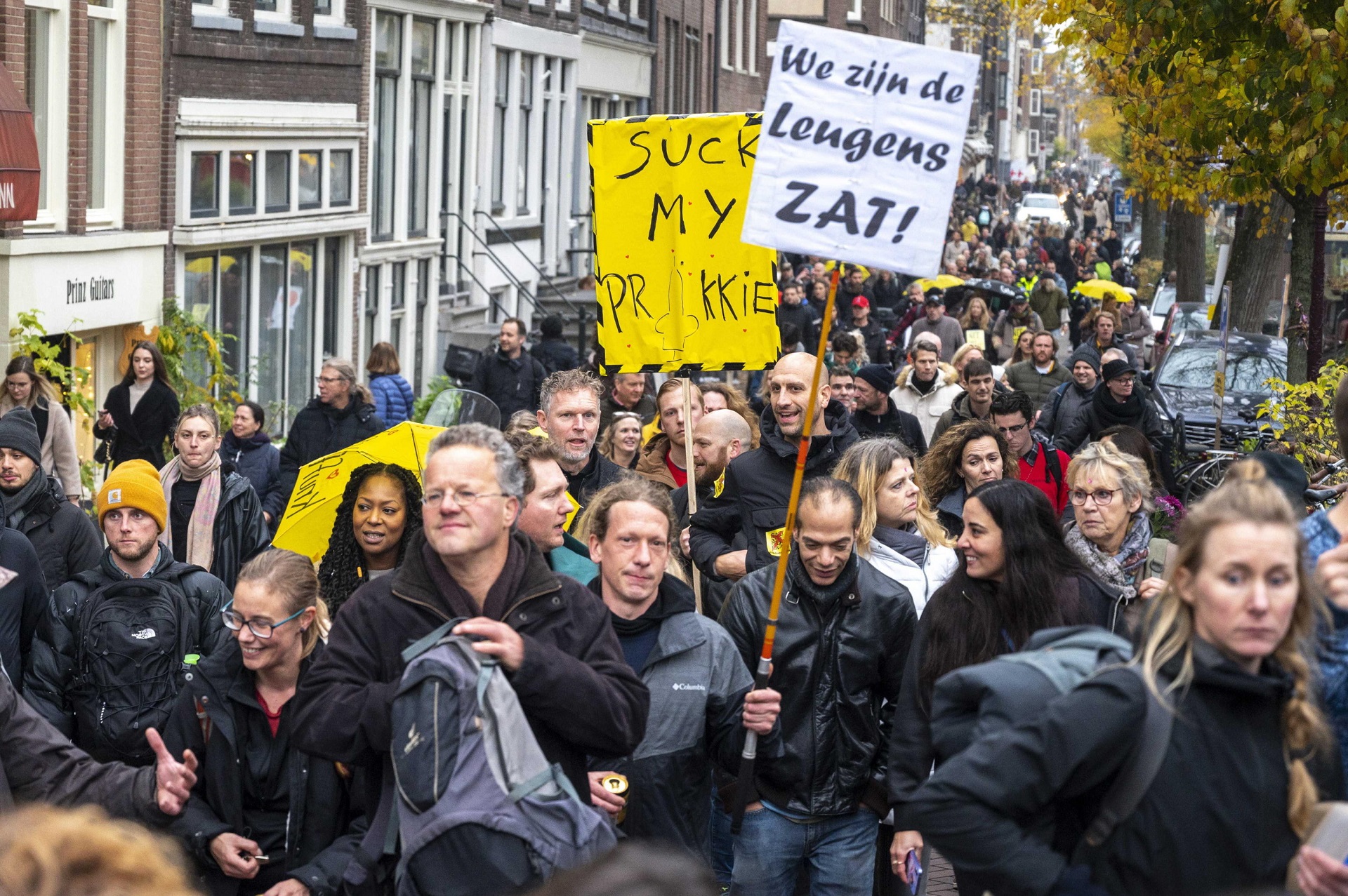 epa09593926 Protesters demonstrate against the coronavirus pandemic measures, in Amsterdam, The Netherlands, 20 November 2021. The announced demonstration was canceled by the organizers because of the riots in Rotterdam, but that did not stop many people from coming to the capital.  EPA/EVERT ELZINGA