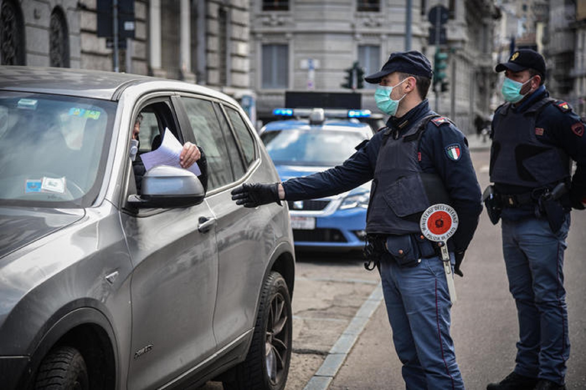 Italian Police officers performs a road block in Venezia street due to the Coronavirus emergency, Milan, Italy, 23 March 2020.  ANSA / Matteo Corner