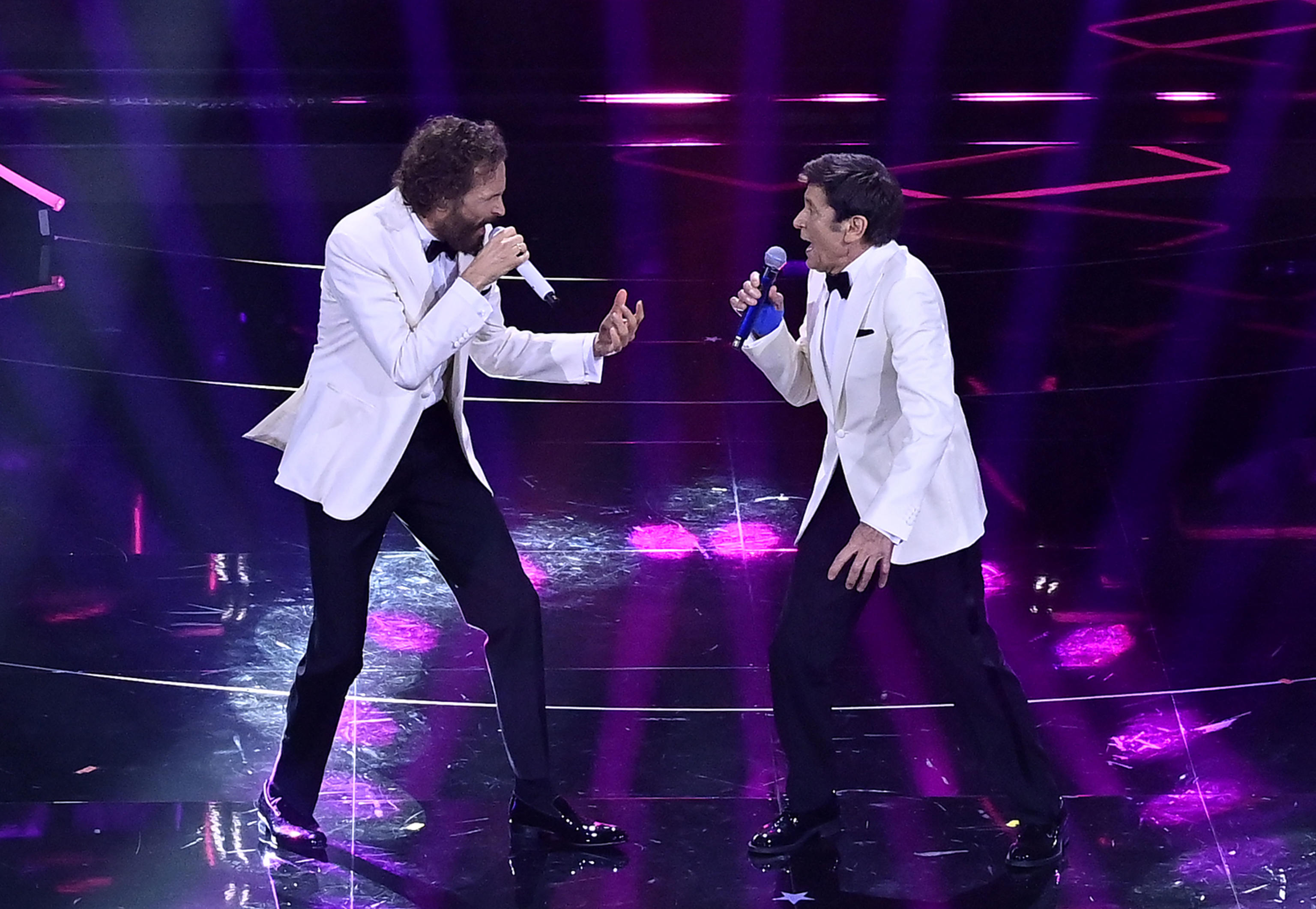 Italian singers Jovanotti (L) and Gianni Morandi (R)perform on stage at the Ariston theatre during the 72nd Sanremo Italian Song Festival, in Sanremo, Italy, 04 February 2022. The music festival runs from 01 to 05 February 2022.    ANSA/RICCARDO ANTIMIANI