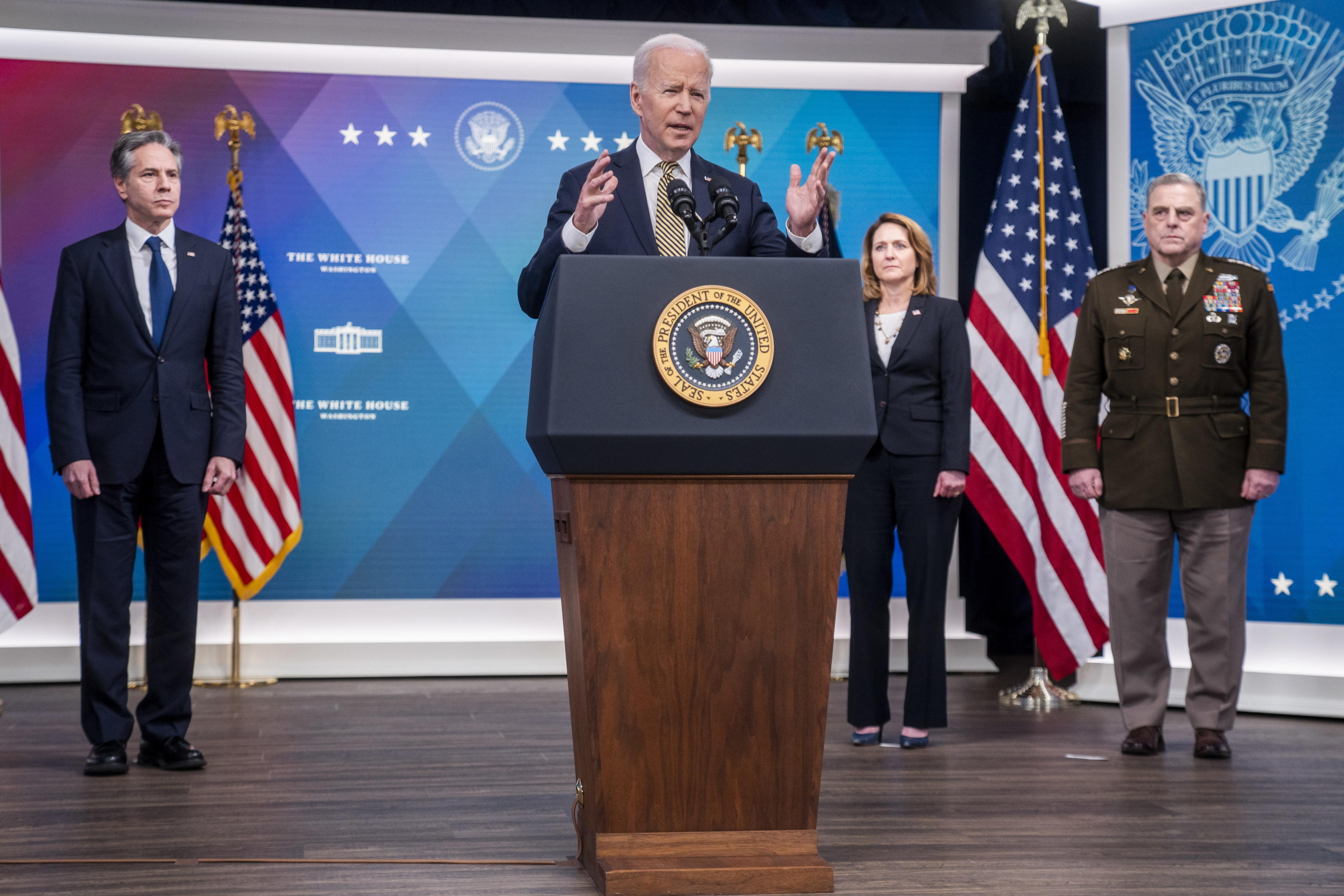 epa09829312 US President Joe Biden, with Secretary of State Antony Blinkin (L), Deputy Secretary of Defense Kathleen Hicks (2-R) and Chairman of the Joint Chiefs of Staff General Mark Milley (R), delivers remarks on the assistance the United States is providing to Ukraine in the South Court Auditorium of the White House in Washington, DC, USA, 16 March 2022.  President Biden's remarks follow Ukrainian President Volodymyr Zelensky's emotional virtual address to Congress, asking for help in defending against the Russian invasion.  EPA/SHAWN THEW