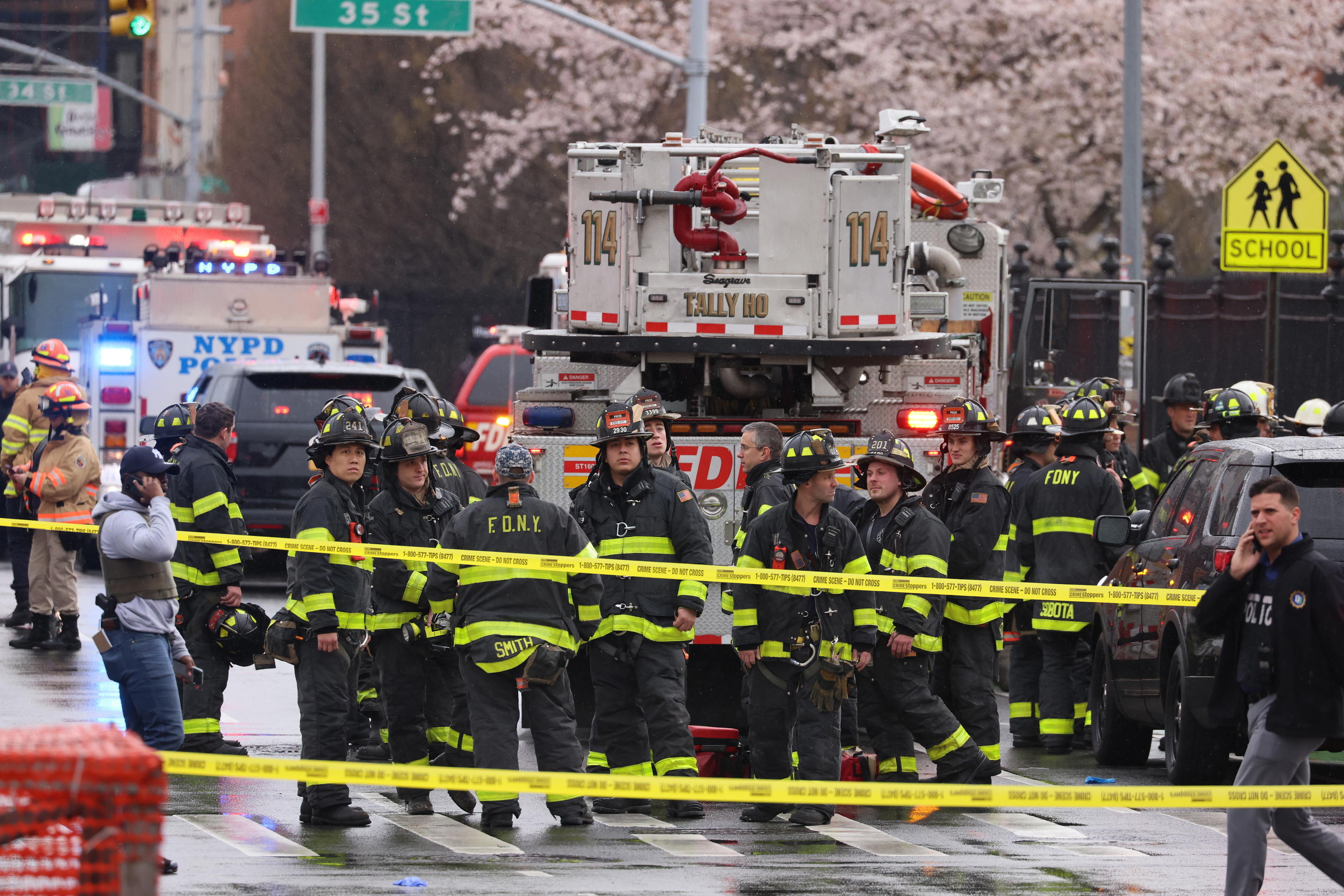 epa09885985 New York City Police and Fire Department officials on the scene of a reported multiple shooting at a New York City Subway station in the Brooklyn borough of New York, New York, USA, 12 April 2022.  EPA/JUSTIN LANE