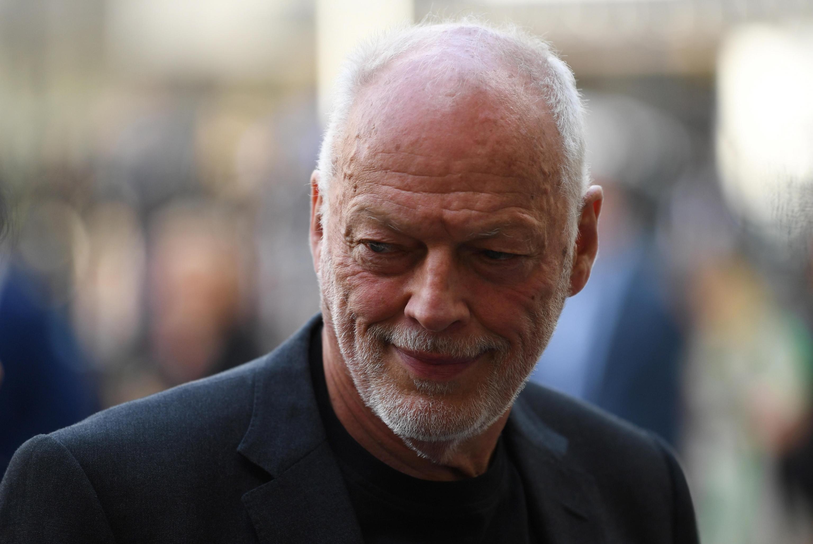 epa06809678 British musician David Gilmour arrives at a memorial service for physicist Professor Stephen Hawking at Westminster Abbey in London, Britain, 15 June 2018. Professor Hawking died in March 2018, aged 76, after a battle with motor neurone disease, during the memorial ceremony Hawking's ashes will be buried alongside other scientists including Charles Darwin and Isaac Newton.  EPA/NEIL HALL