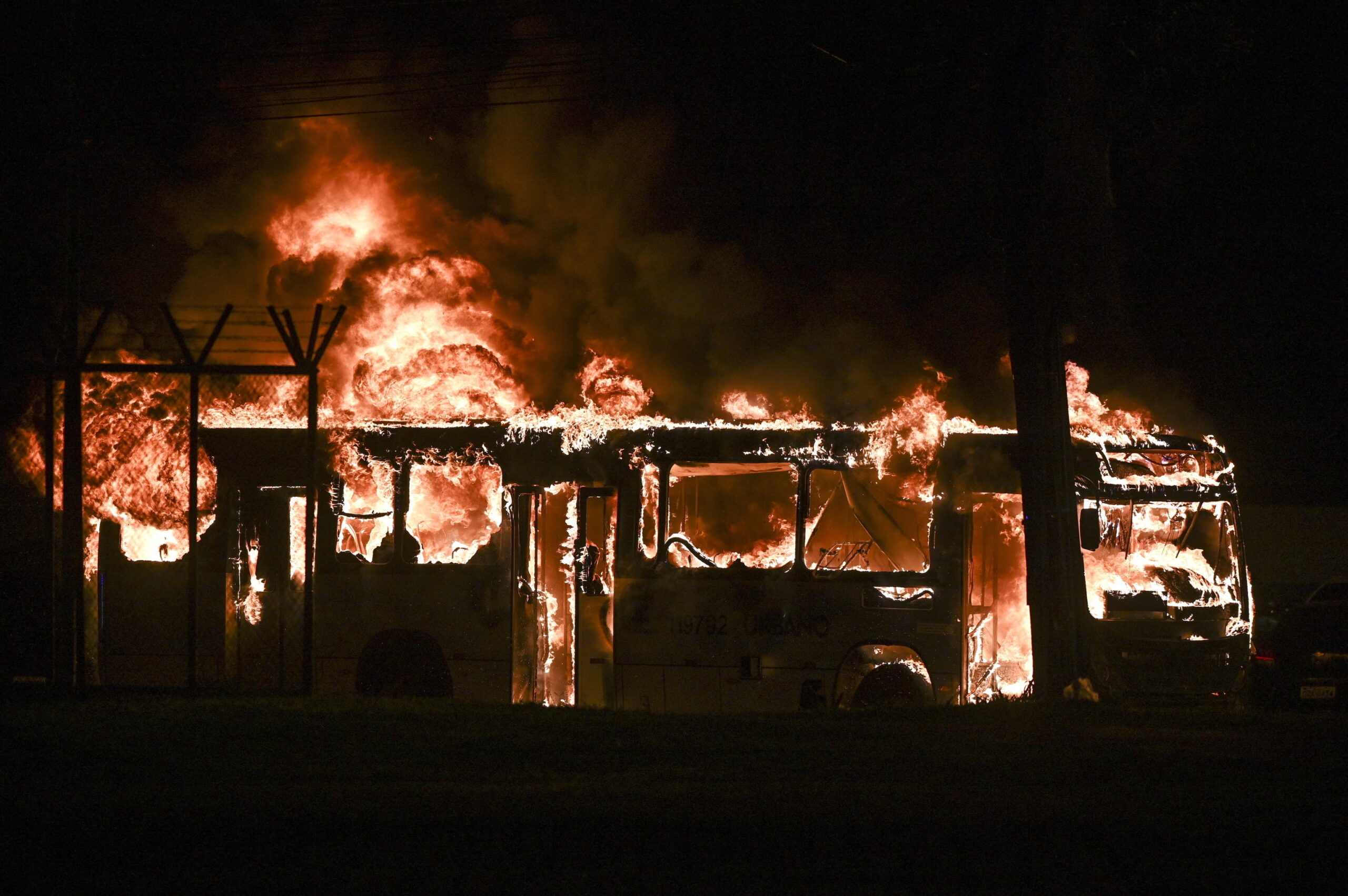 epa10362677 A bus set on fire by followers of outgoing President of Brazil Jair Bolsonaro burns during a protest, in Brasilia, Brazil, 12 December 2022. Followers of Bolsonaro tried to invade one of the Federal Police headquarters in Brasilia in retaliation for the arrest of one of their leaders, who is calling for a coup. The demonstrators set fire to vehicles parked at the police headquarters.  EPA/Andre Borges