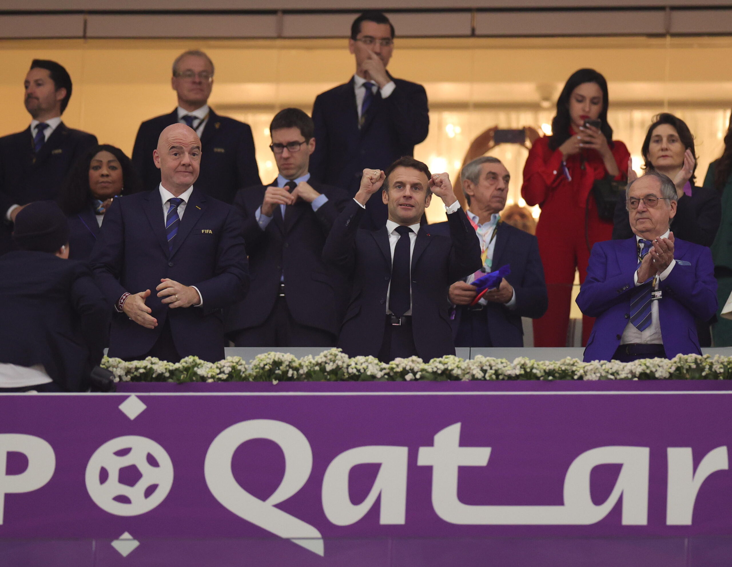 epa10365799 French President Emmanuel Macron (C) and and FIFA President Gianni Infantino (L) arrive for the FIFA World Cup 2022 semi final between France and Morocco at Al Bayt Stadium in Al Khor, Qatar, 14 December 2022.  EPA/Friedemann Vogel