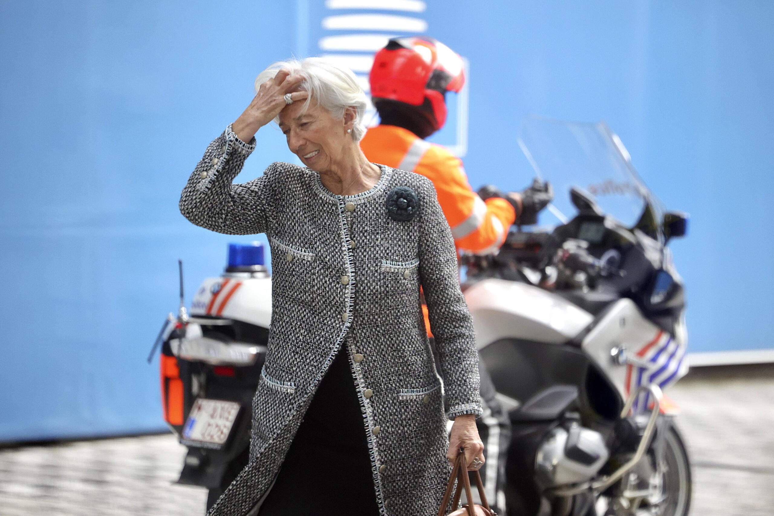 epa10540692 European Central Bank (ECB) President Christine Lagarde waits for her car as she leaves the building after an EU summit at the European Council building in Brussels, Belgium, 24 March 2023. EU leaders met for a two-day summit to discuss the latest developments in relation to 'Russia's war of aggression against Ukraine' and continued EU support for Ukraine and its people. The leaders were also debating on competitiveness, single market and the economy, energy, external relations among other topics, including migration.  EPA/Olivier Matthys / POOL