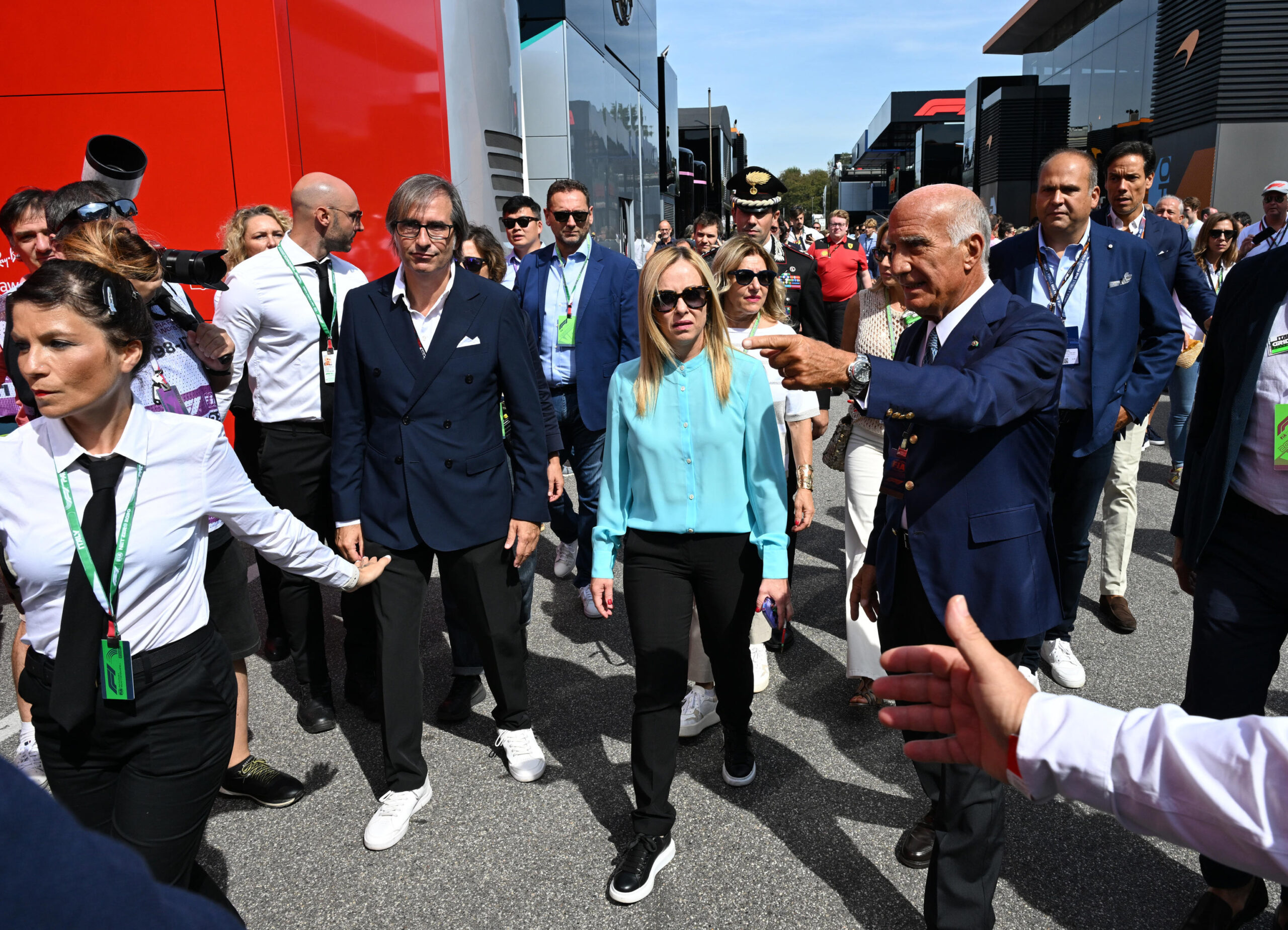 Italian Prime Minister Giorgia Meloni  (C) has a tour at the paddock area at her arrival to attend the Italian Formula One Grand Prix at the Autodromo Nazionale in Monza, Italy, 3 september 2023. ANSA/DANIEL DAL ZENNARO
