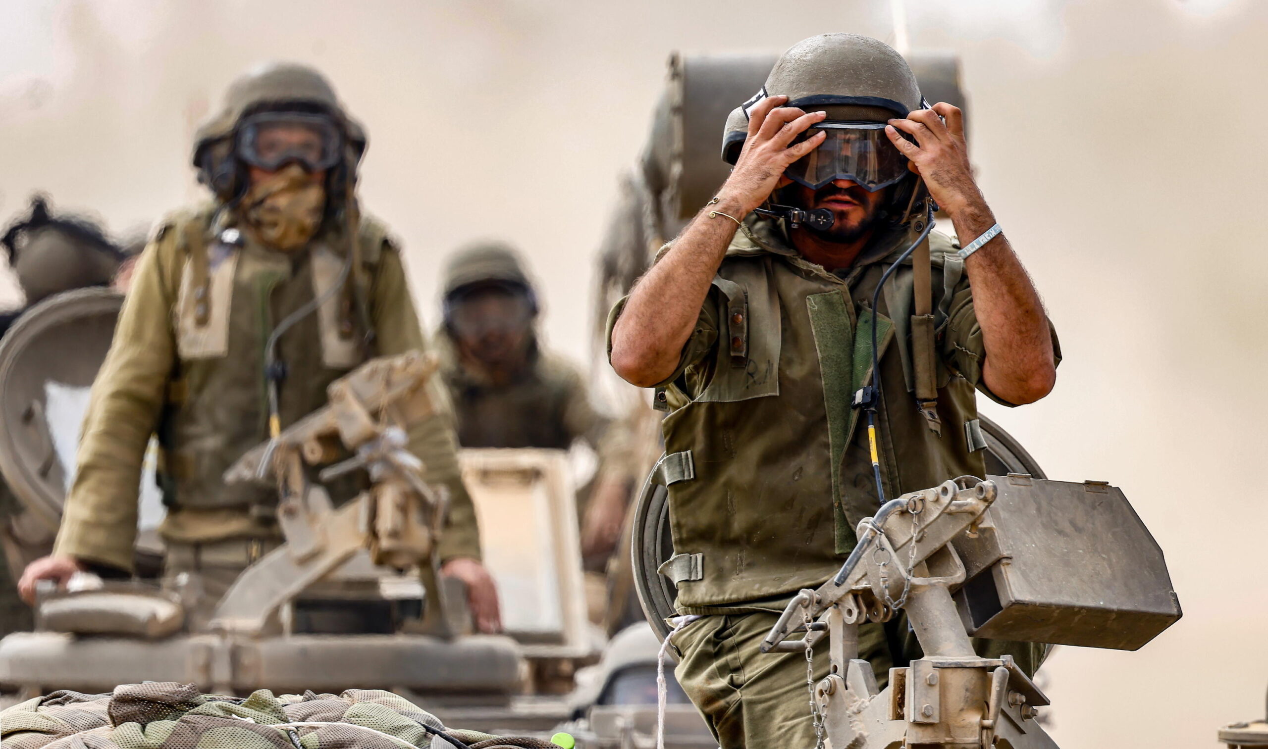 epa10923251 Israeli troops in Armoured Personnel Carriers patrolling along the Israel-Gaza border 18 October 2023.  Israel has warned all citizens of the Gaza Strip to move to the south ahead of an expected invasion. More than 2,750 Palestinians and 1,300 Israelis have been killed according to the IDF and Palestinian health ministry, after Hamas militants launched an attack against Israel from the Gaza Strip on 07 October.  EPA/HANNIBAL HANSCHKE