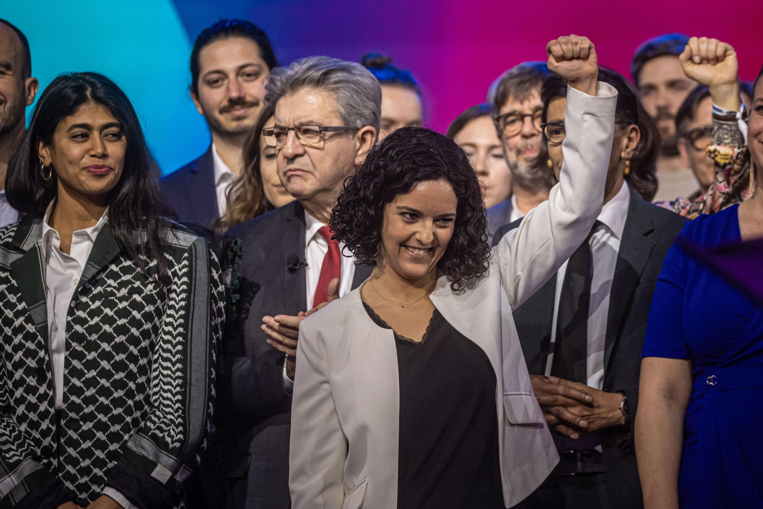 epa11224256 French-Palestinian activist Rima Hassan (L), French left-wing La France Insoumise (LFI) party leader Jean-Luc Melenchon (CL) and party's head of list for European parliamentary election Manon Aubry (C) react after delivering their speeches as the party launches European election campaign in Villepinte, near Paris, France, 16 March 2024. Elections for the European Parliament are due to take place between 06 and 09 June 2024.  EPA/CHRISTOPHE PETIT TESSON