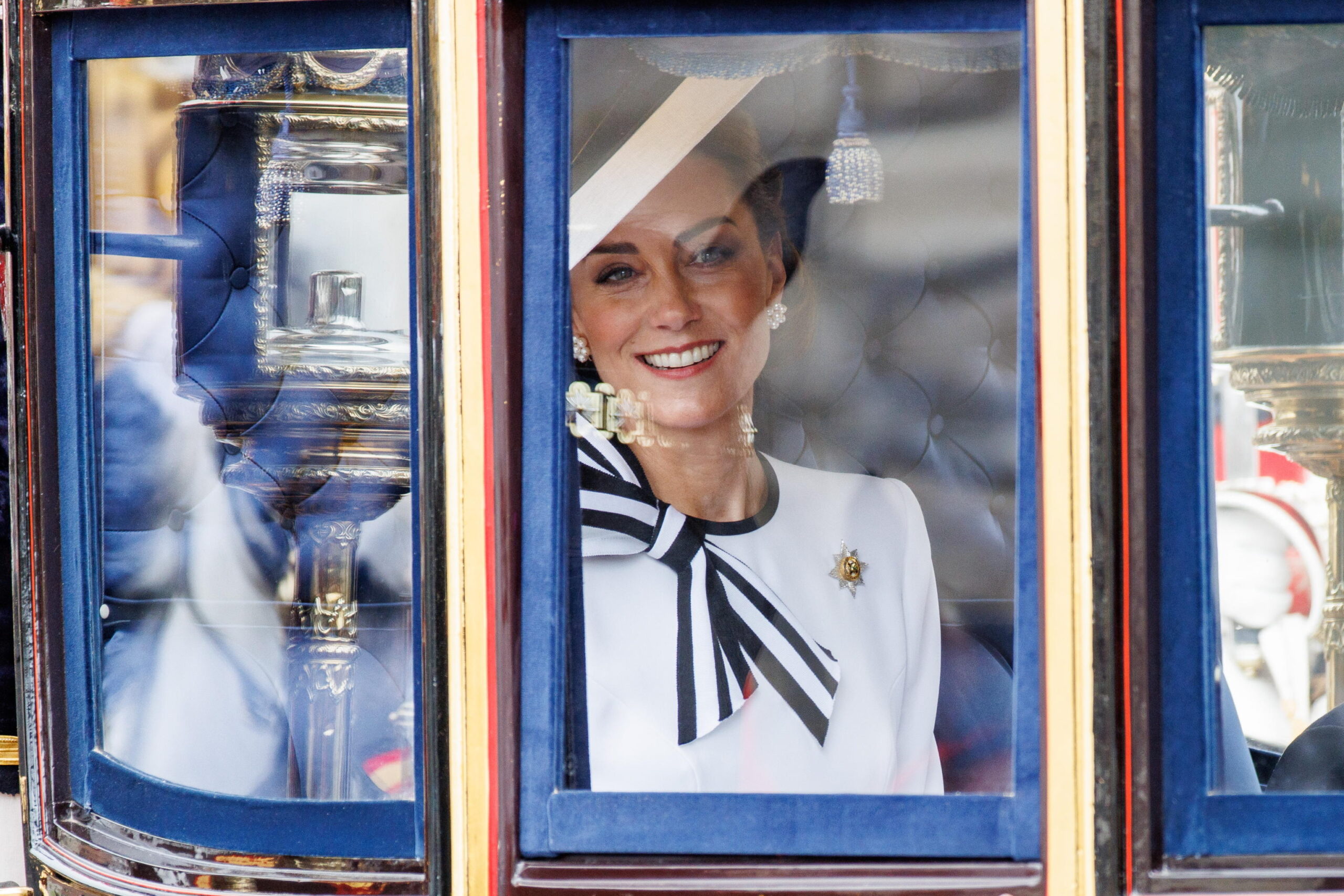 epaselect epa11411614 Britain's Catherine Princess of Wales smiles as she travels from Buckingham Palace to Horse Guards Parade inside a carriage during the Trooping the Colour parade in London, Britain, 15 June 2024. The Princess of Wales made her first public appearance since she disclosed that she has been diagnosed with cancer in March 2024. The king's birthday parade, traditionally known as Trooping the Colour, is a ceremonial military parade to celebrate the official birthday of the British sovereign.  EPA/TOLGA AKMEN
