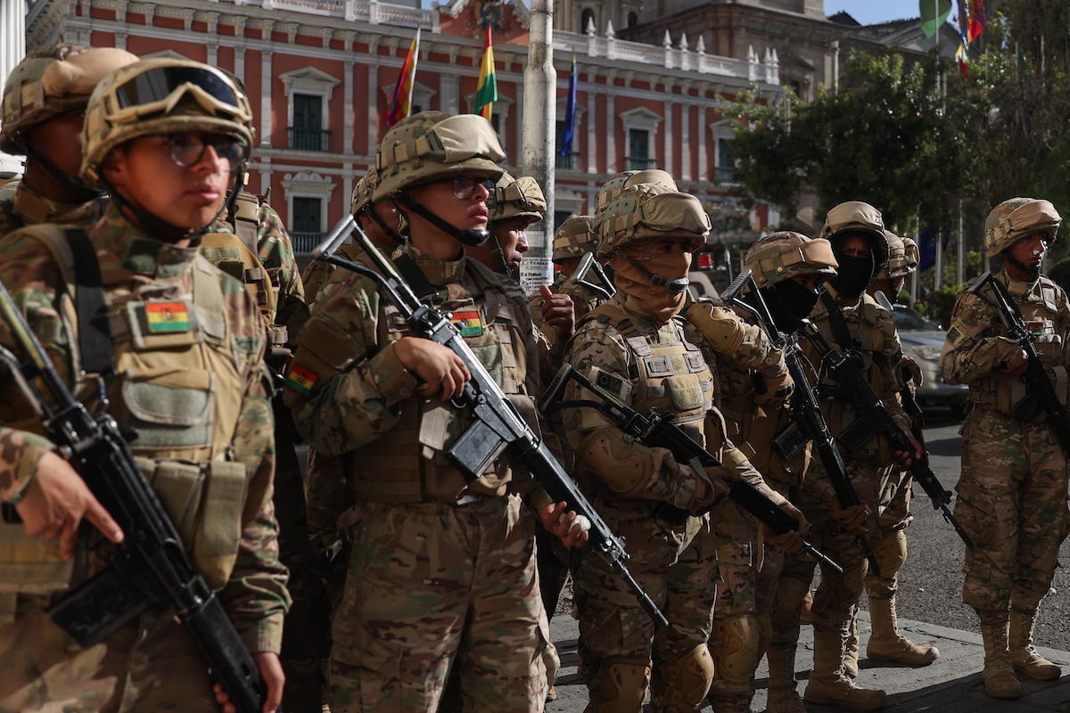 epa11440598 Military personnel at the headquarters of the Government of Bolivia in La Paz, Bolivia, 26 June 2024. Bolivia's President Luis Arce denounced the 'irregular mobilization' of some units of the Bolivian military, he wrote in a post on social media. The vice president of Bolivia David Choquehuanca announced a 'coup d'etat' is taking place against the Government of Luis Arce, after a tank forcibly entered the Executive headquarters in the city of La Paz.  EPA/Luis Gandarillas