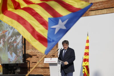 epa11535524 Former Catalan president Carles Puigdemont addresses supporters in Barcelona, Spain, 08 August 2024. Catalonia's former president Carles Puigdemont returned to Spain after seven years of self-imposed exile abroad, despite a pending arrest warrant. The Mossos d'Esquadra was deployed early morning on 08 August to secure access to the Parliament for the investiture of Salvador Illa. The plenary session of the Parliament will host the investiture debate of the Socialist leader Salvador Illa as the new president of the Generalitat, the government of Catalonia. EPA/ALBERTO ESTEVEZ