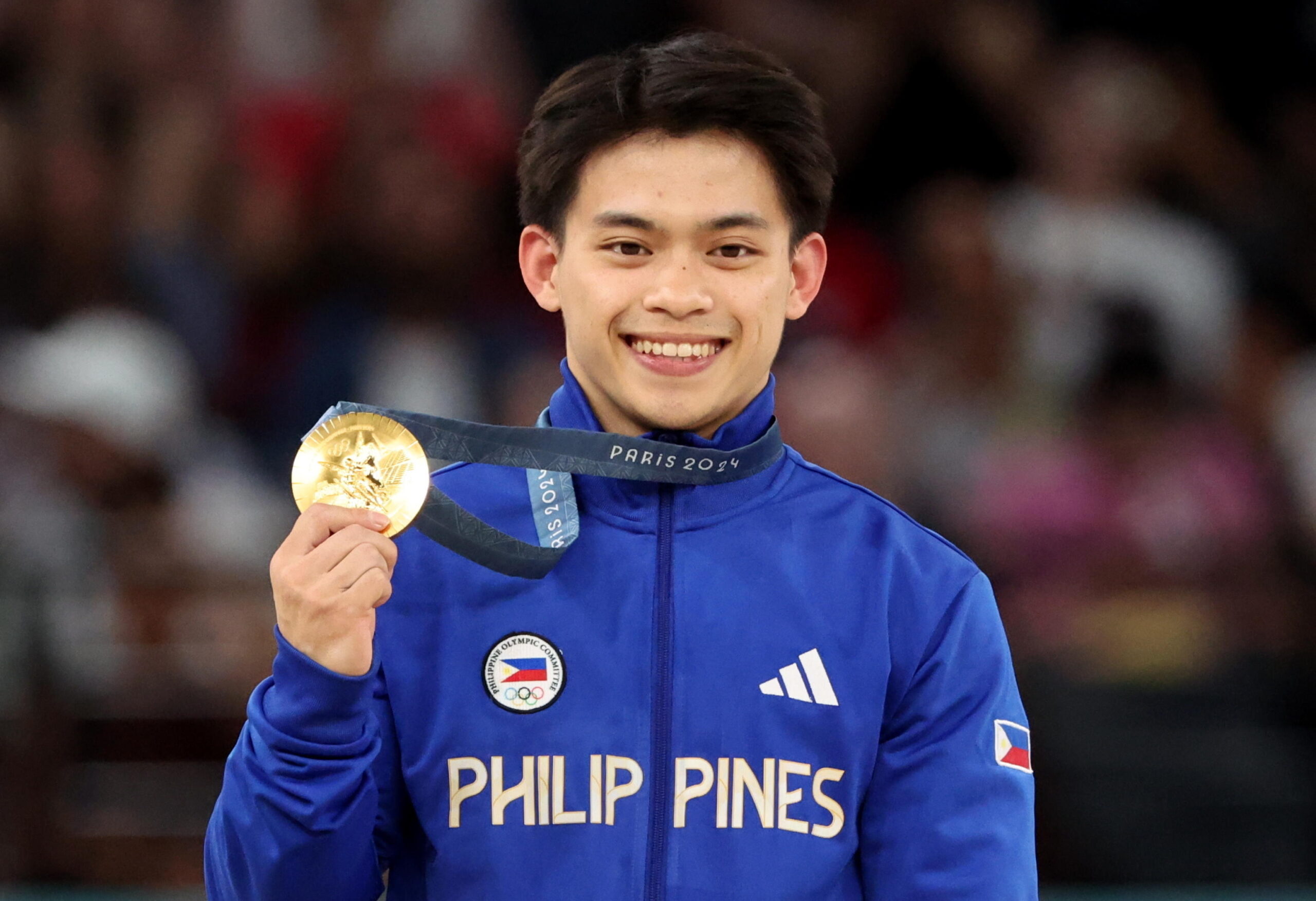 Gold medal winner Carlos Edriel Yulo of Philippines poses on the podium of the Men's Vault Final of the Artistic Gymnastics competitions in the Paris 2024 Olympic Games, at the Bercy Arena in Paris, France, 04 August 2024. EPA/YAHYA ARHAB