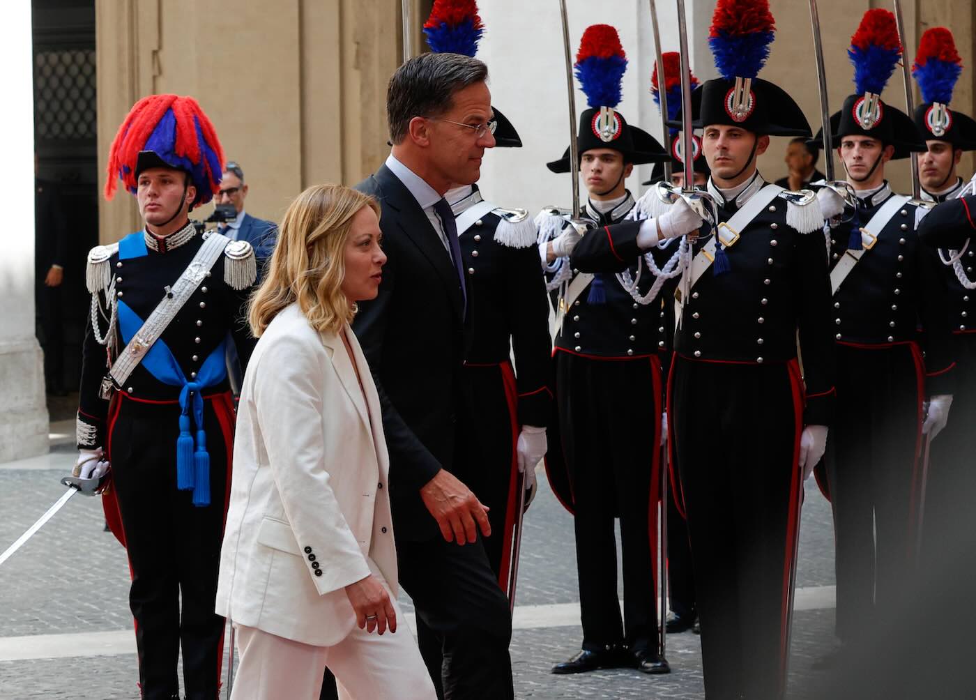 https://static.open.online/wp-content/uploads/2025/06/rutte-meloni-palazzo-chigi.jpeg