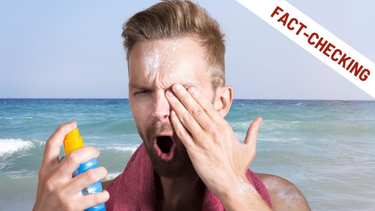 Uomo in spiaggia con crema solare sul viso e in mano un flacone spray, espressione di sorpresa o fastidio, con scritta "Fact-Checking" in alto a destra