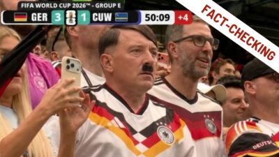 Screenshot manipolato che mostra un uomo con le sembianze di Hitler tra i tifosi tedeschi sugli spalti durante Germania-Curacao ai Mondiali 2026, con il punteggio 3-1 visibile nella grafica televisiva