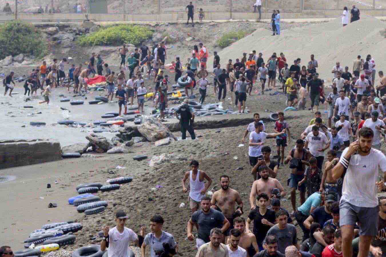 https://static.open.online/wp-content/uploads/2026/07/Ceuta-spiaggia-migrati.jpg