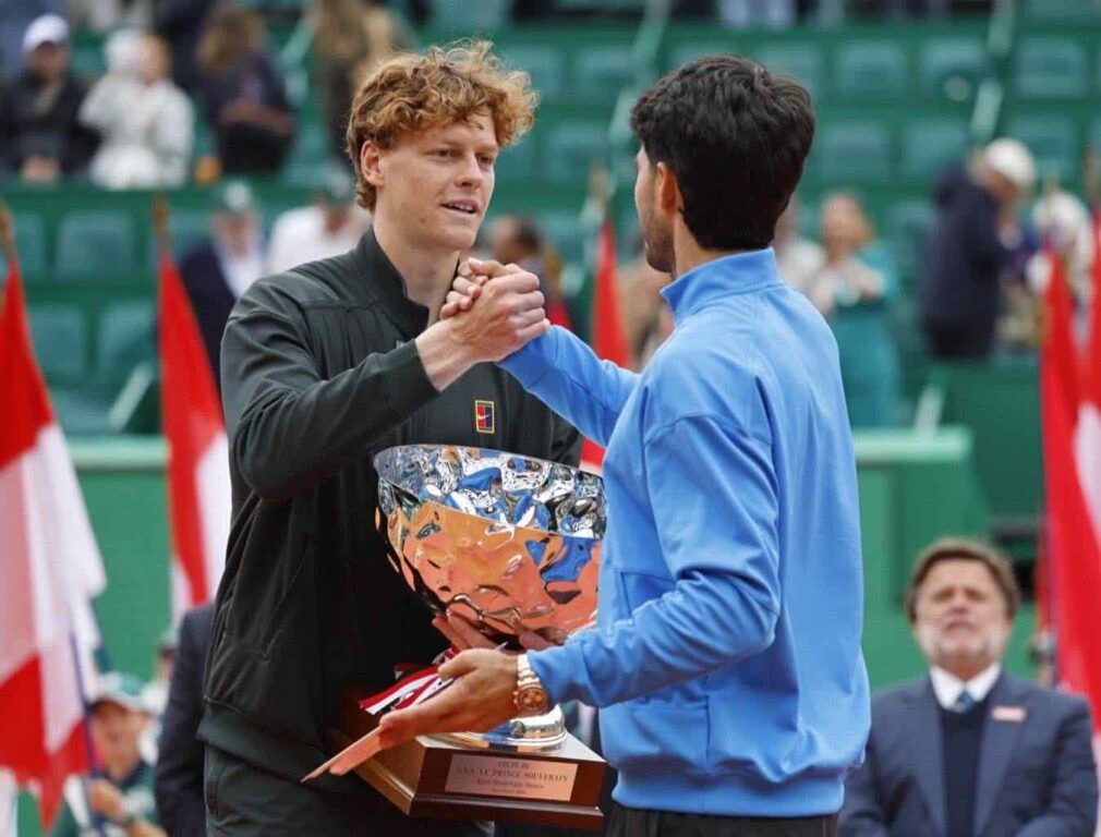 epa12885329 Carlos Alcaraz of Spain (R) congratulates Jannik Sinner of Italy (L) after Sinner won their men's singles final match at the ATP Monte Carlo Masters tennis tournament in Roquebrune Cap Martin, France, 12 April 2026. EPA/SEBASTIEN NOGIER